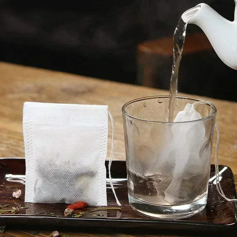 50 pz/lotto bustine di tè usa e getta bustine di filtro per tè in tessuto Non tessuto per bustine di tè per spezie al caffè con filtri con coulisse Teaware da cucina