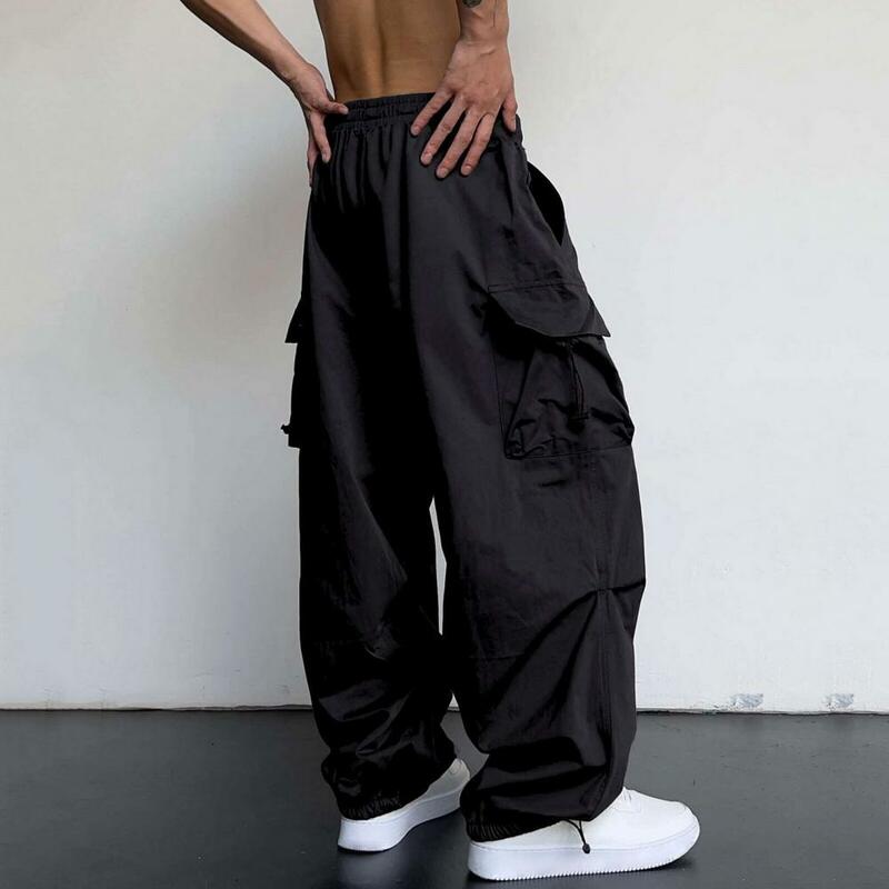 Calças de cintura elástica para homens, calças de cintura alta com virilha, design multi bolso, cor sólida extragrande