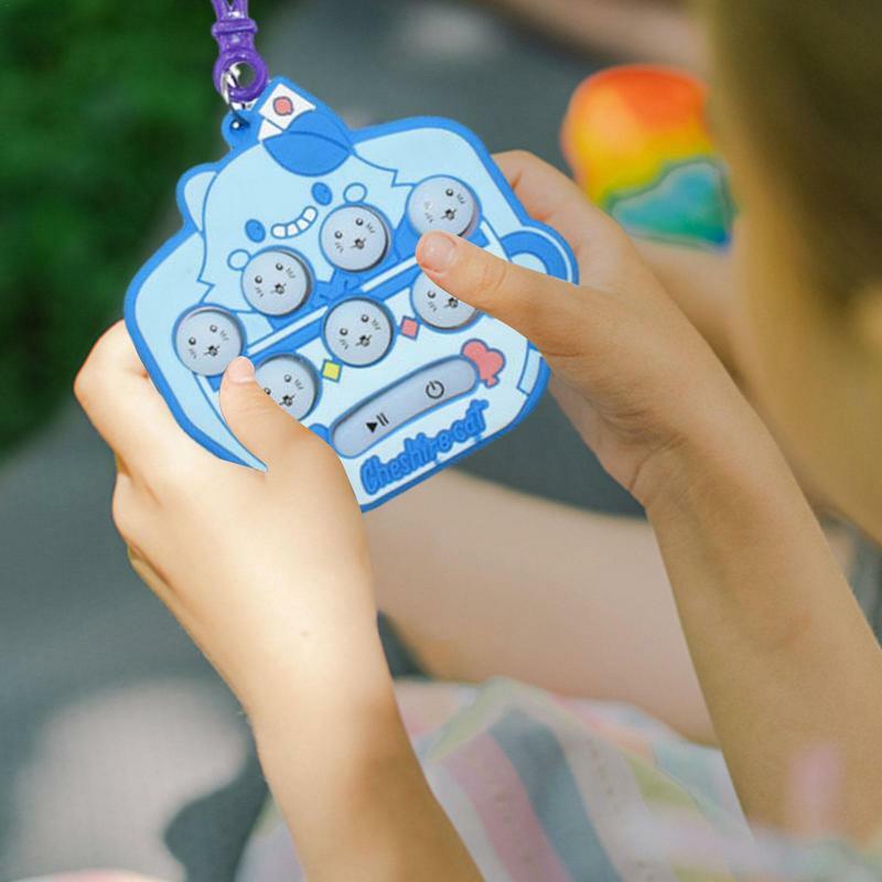 พวงกุญแจของเล่นอิเล็กทรอนิกส์แบบเด้งได้มีไฟของเล่นแบบฟองสบู่กดของเล่นสำหรับเด็ก