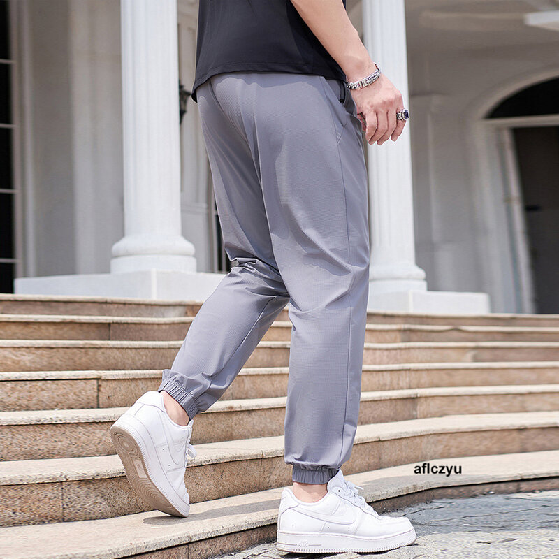 Pantalones de chándal de talla grande para hombre, Color sólido, a la moda, informales, con cintura elástica, 8XL