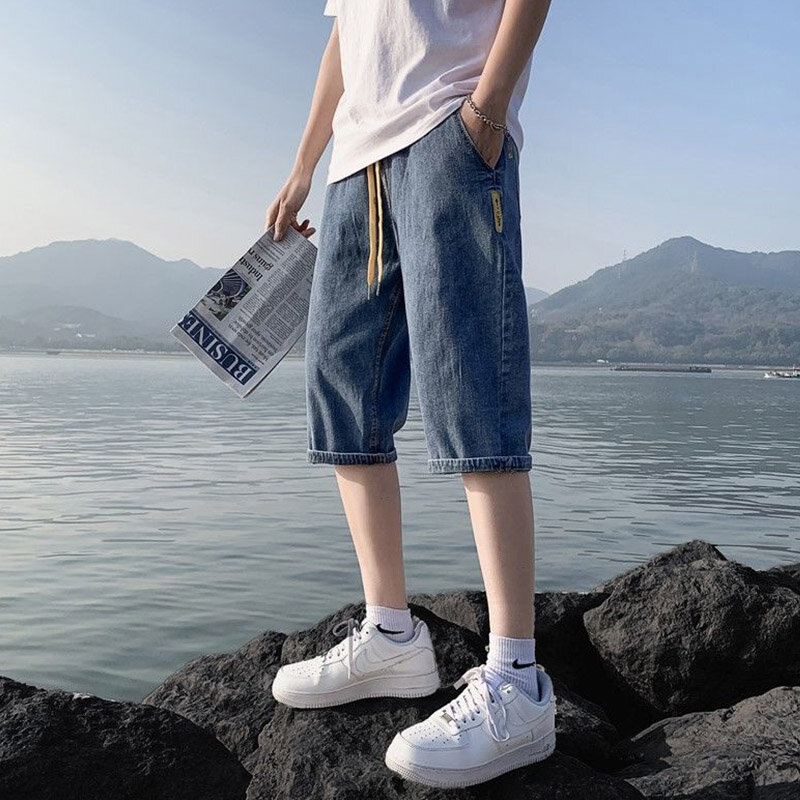 กางเกงแฟชั่นเวอร์ชันเกาหลีเอวยางยืดสำหรับผู้ชาย, กางเกงเอวยางยืดมีเชือกหูรูดทรงหลวมบางใหญ่5XL celana pendek DENIM ใหม่ฤดูร้อน