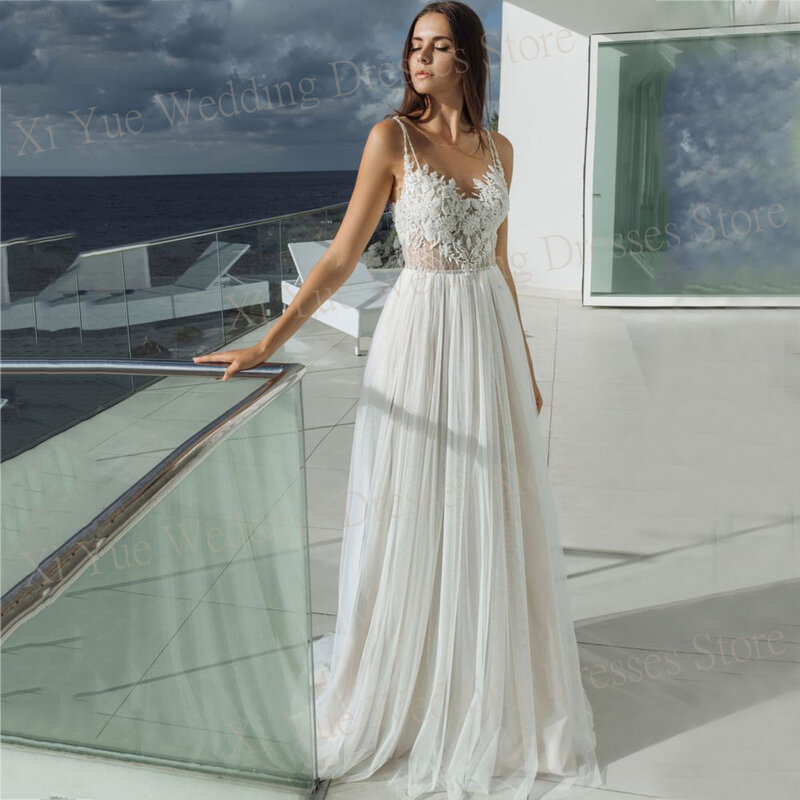Eleganckie tiulowa suknia ślubna koronkowe aplikacje bez rękawów bez pleców suknie panny młodej urocze paski Spaghetti Vestido De Novia