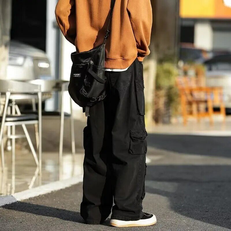 Jalanan populer banyak saku overall pria gaya Harajuku celana kasual longgar jalan tinggi Retro wanita celana panjang Hip Hop longgar