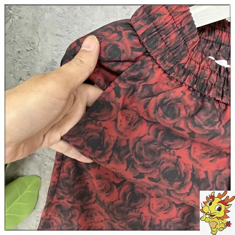 Pantalones cortos rosas para hombre, pantalón de playa con abertura roja Pi Shuai, marca de Instagram, 2024