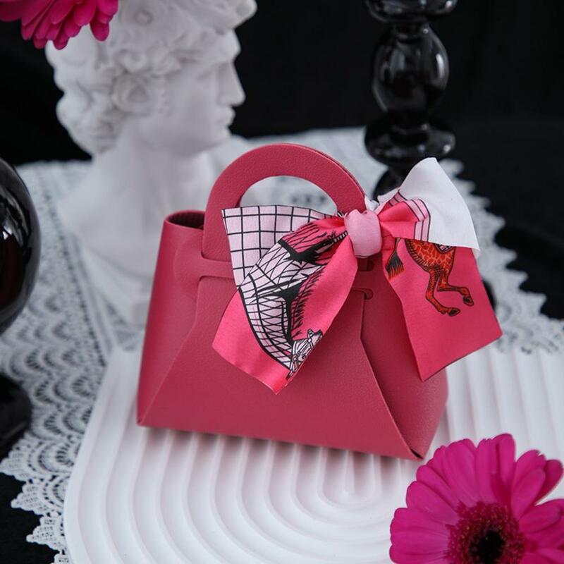 Mini borsa con nastro creativo pieghevole in pelle PU bambini Gilrs principessa borsa portamonete decorazione di nozze sacchetto di caramelle portachiavi