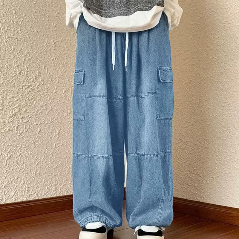 Celana kargo Jeans longgar Denim celana kargo dengan pinggang elastis beberapa saku untuk pria celana panjang kaki lebar kebesaran warna Solid
