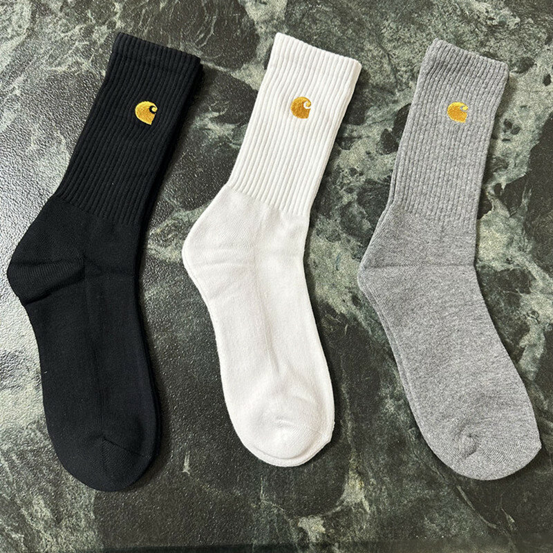 3 pairs of black, white, and gray men's sports socks with simple embroidery style and thickened soles