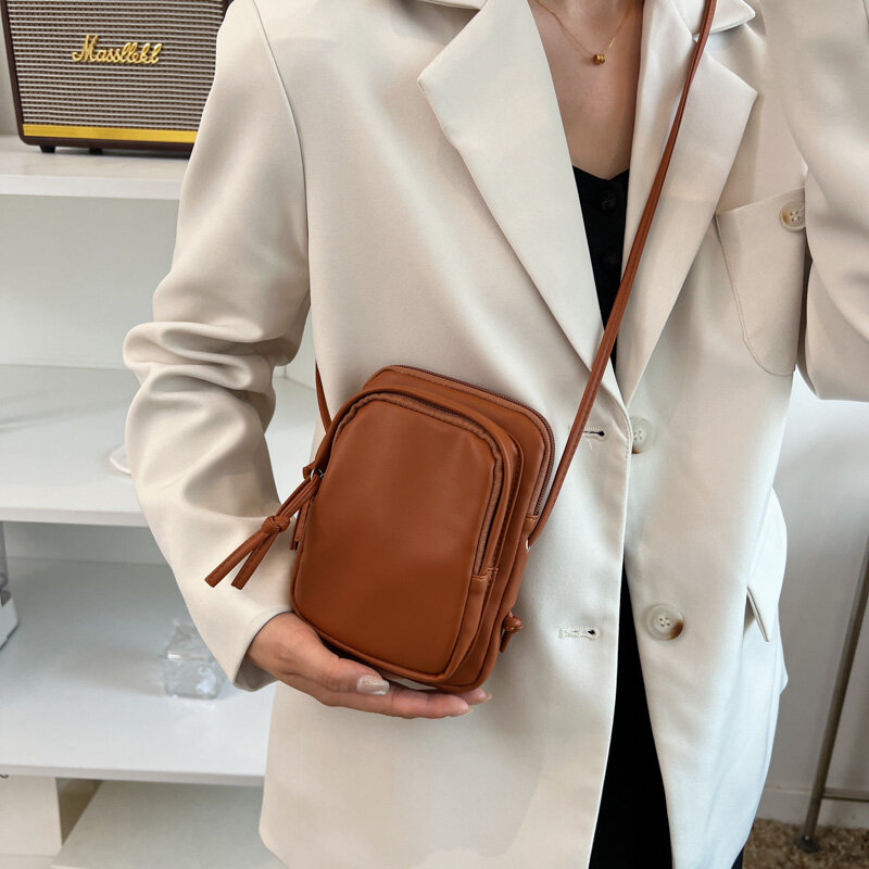 Pequena bolsa de ombro de couro para mulheres, bolsa fina, bolsa de telefone, bolsa com zíper, mini bolsa crossbody, design de marca, jovem