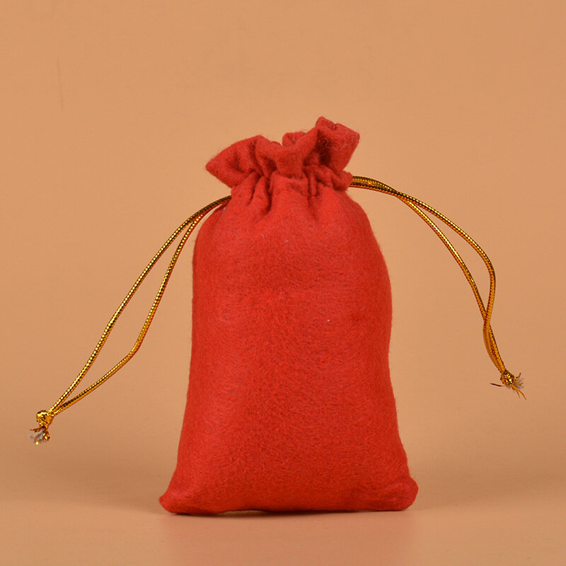 50 unids/lote 10x15 cm tela de fieltro rojo bolsa con cordón regalo de Halloween auricular juguete joyería embalaje bolsas de exhibición al por mayor