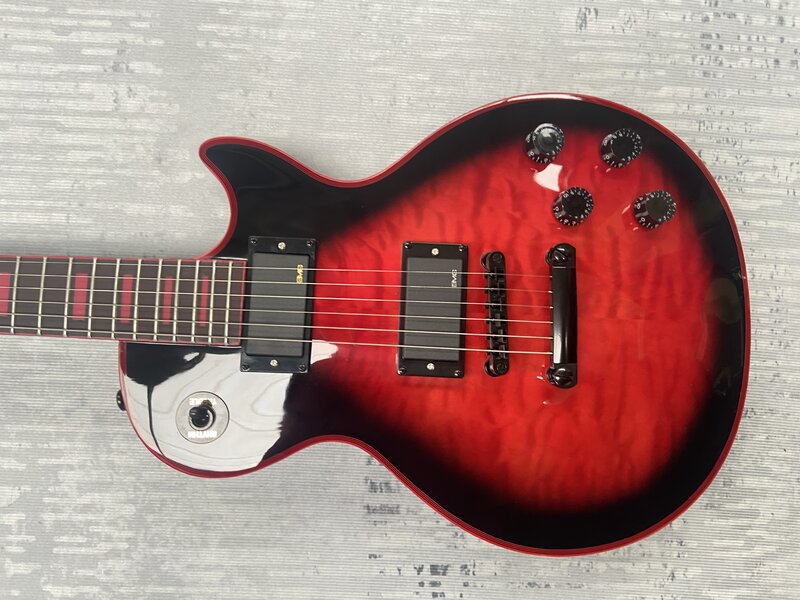 Gitar listrik, memiliki Gib $ on logo, besar pola veneer merah, logo merah mosaik merah, dibuat di Cina .. Bodi mahoni, gratis ongkos kirim