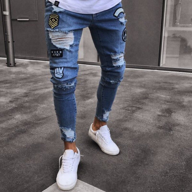 European and American Men's Ripped Jeans Y2K Personality Trend Slim Knee Ripped Peanuts Zipper Badge Patchwork Denim Trousers