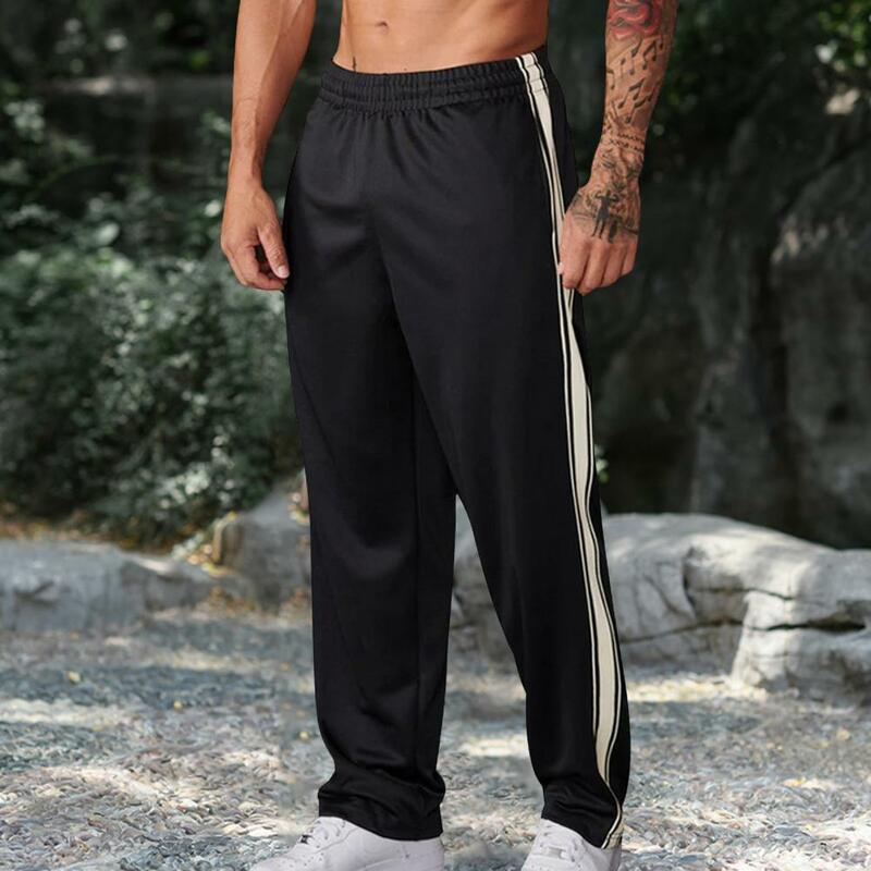Calças esportivas de cintura elástica ajuste solto masculino, detalhe listra lateral, calças de jogging macias, treinamento de ginástica