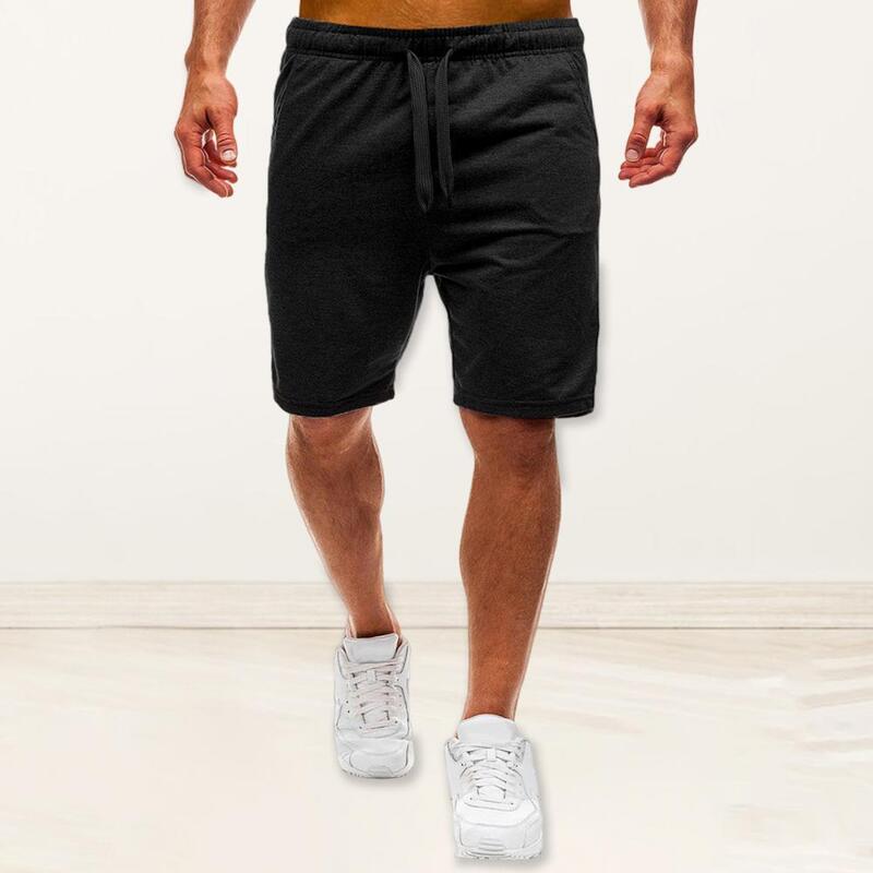 Celana pendek atletik pria, celana pendek atletik musim panas dengan tali serut elastis kantong pinggang warna Solid untuk Streetwear