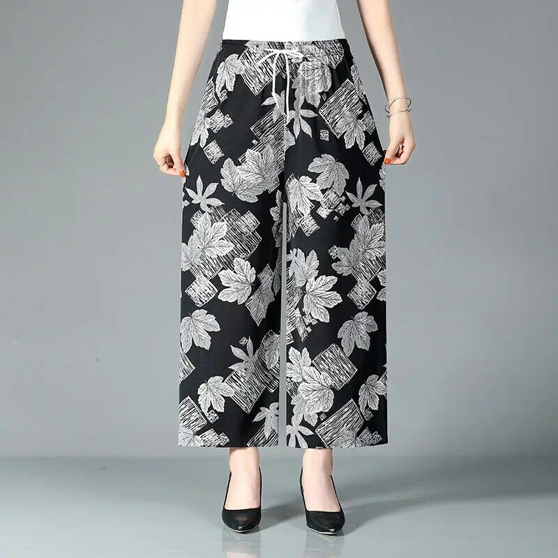 Celana kasual Vintage cetak Folk pakaian wanita pinggang tinggi elastis Fashion serut 2024 musim panas tipis kaki lebar celana crop