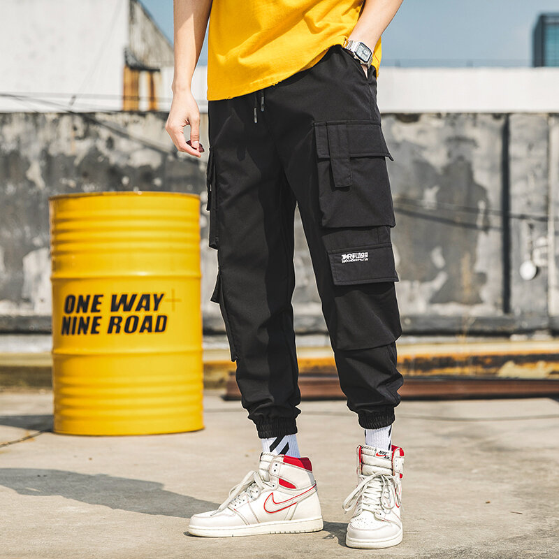 Moda uliczna męska Hip Hop spodnie do joggingu męskie spodnie Casual luźne spodnie dresowe męskie nowe kilka kieszeni spodnie haremowe 5XL