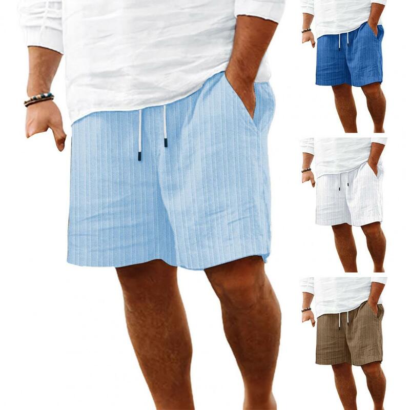 กางเกงขาสั้นผู้ชายขาสั้นแบบผูกเชือกเอวยางยืดปรับได้มีกระเป๋าเสริมขาสั้นขากว้างสีทึบฤดูร้อน