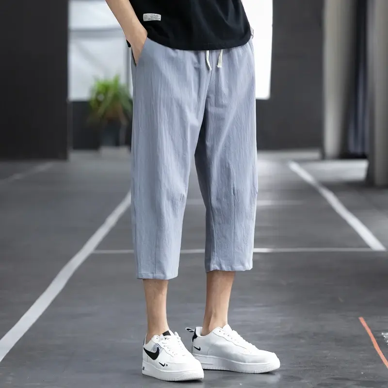 Celana kasual pria Musim Panas 2024 celana panjang lurus sembilan poin tren gaya Korea Linen longgar katun dan Linen liar