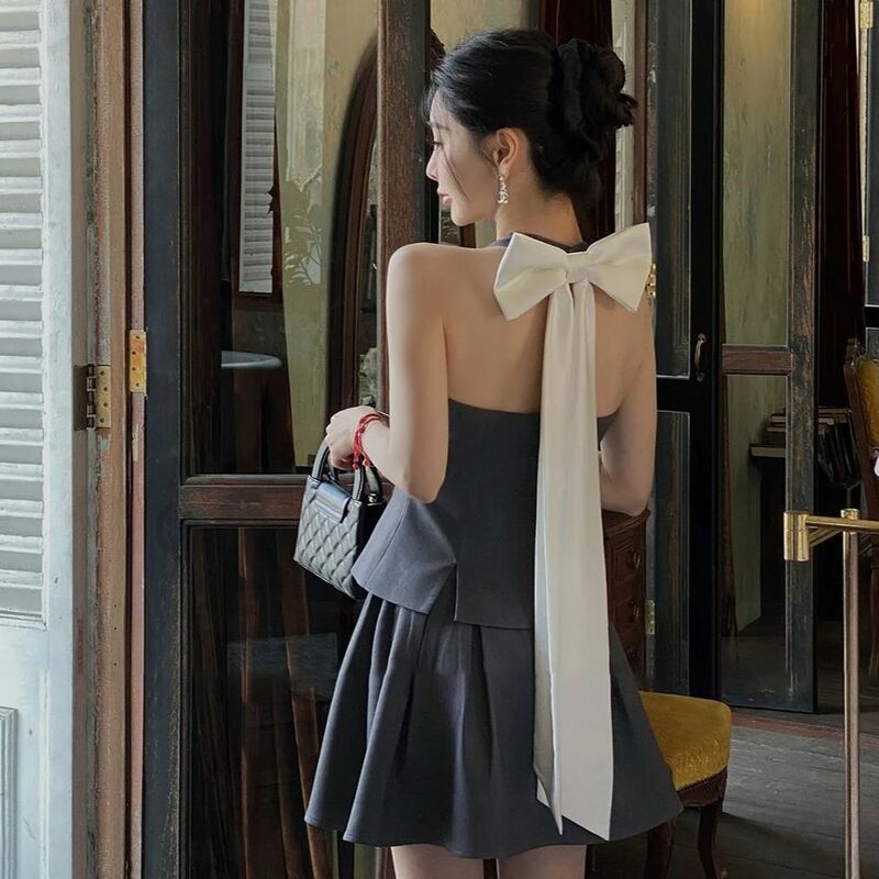 Dwuczęściowy garnitur z kokardą patchworkowy bez pleców seksowny 2024 wiosenny nowa, w stylu Streetwear kontrastowy kolor damski plisowana spódnica o linii