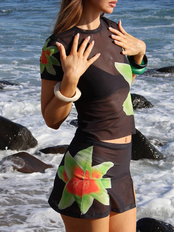 Falda negra Sexy para mujer, Top corto de malla transparente, minifalda acampanada, traje informal de verano para vacaciones y playa, 2 piezas