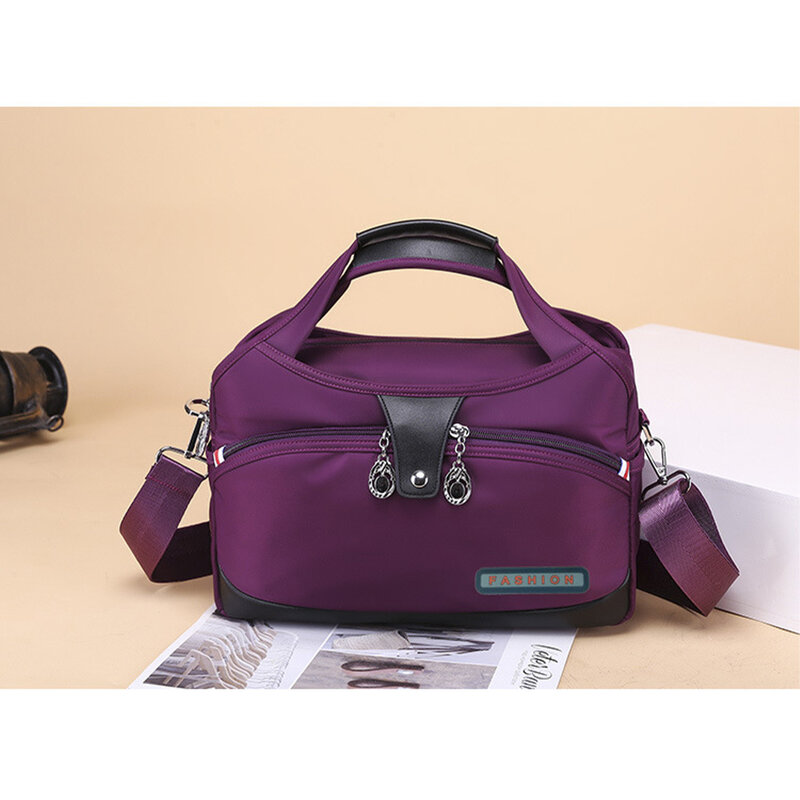 Bolso de hombro versátil para mujer, bolsa de mensajero de tela Oxford, elegante, púrpura, amplia aplicación, hecho a la moda