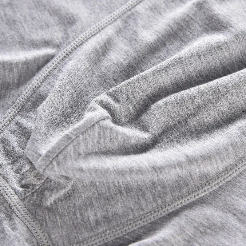 กางเกงในทรงสามเหลี่ยมยืดหยุ่นแฟชั่นผ้าคอตตอนสีพื้นสำหรับผู้ชายกางเกงขาสั้นระบายอากาศได้ดีเซ็กซี่