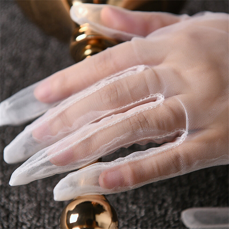 Jesienne letnie damskie krótkie tiulowe rękawiczki białe czarne pielenie rękawiczki elastyczna koronka pełne mitenki Mesh Transparentes rękawiczki
