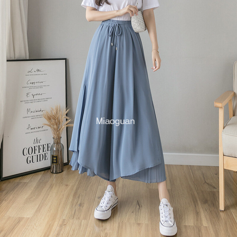 Celana wanita Korea, kulot elastis kaki lebar Hem tidak beraturan lapisan ganda celana musim panas kasual longgar celana lipit bernapas