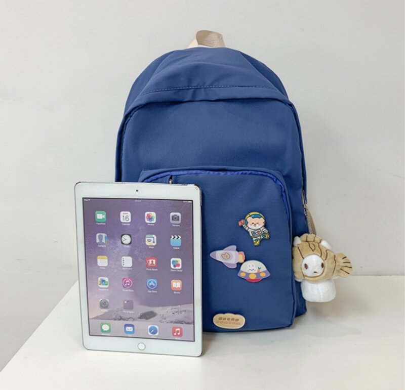 กระเป๋านักเรียนนักศึกษาแบบใหม่กระเป๋าสะพายหลังสีทึบขนาดกลางและนักเรียนม.ปลายแบบกระเป๋าสะพายไหล่แบบลำลอง