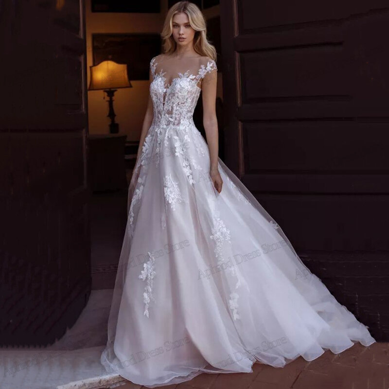 Eleganckie suknie ślubne tiulowe suknie ślubne koronkowe aplikacje bez rękawów bez pleców seksowna sukienka Vintage Vestidos De Novia