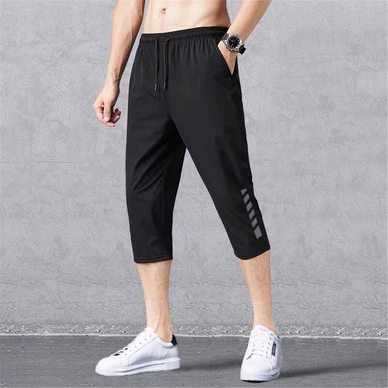 Oddychające sportowe spodnie do biegania męskie wygodne szorty w/kieszeń luźne szybkie suche spodnie do joggingu 3/4 sportowe szorty na lato