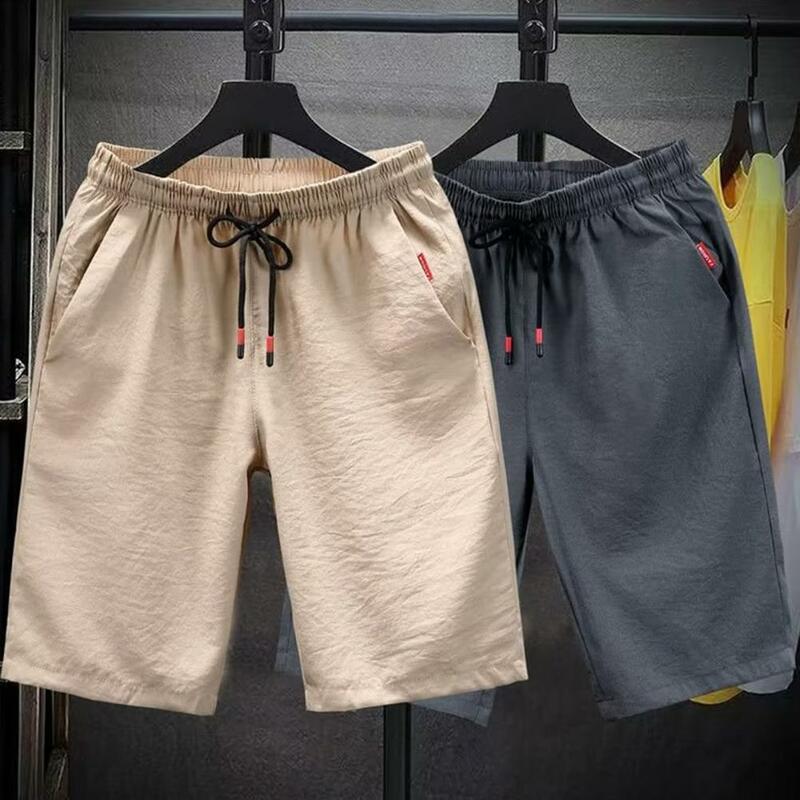Pantalones cortos deportivos para hombre, Shorts holgados de Color sólido con cordón, cintura elástica, trotar, hasta la rodilla, ejercicio, correr, ropa masculina de verano