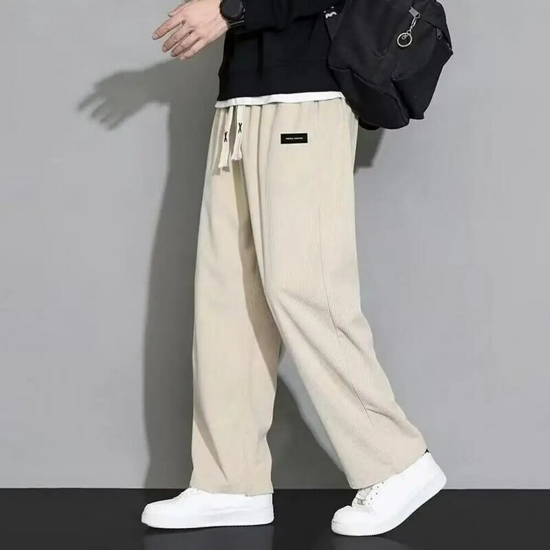 Pantalones de pana de Color puro para hombre, pantalones de pana con estilo, cintura elástica cómoda, ajuste suelto, bolsillos para otoño