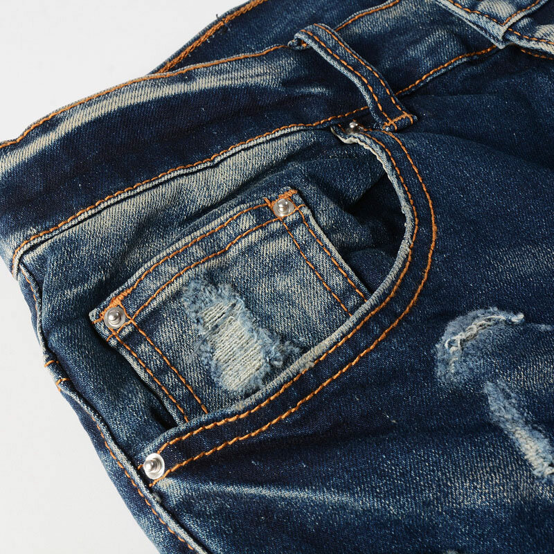 Główna ulica modne dżinsy męskie Retro ciemnoniebieski rozciągliwy chudy krój porwane jeansy mężczyzn skórzany markowe spodnie Hip Hop