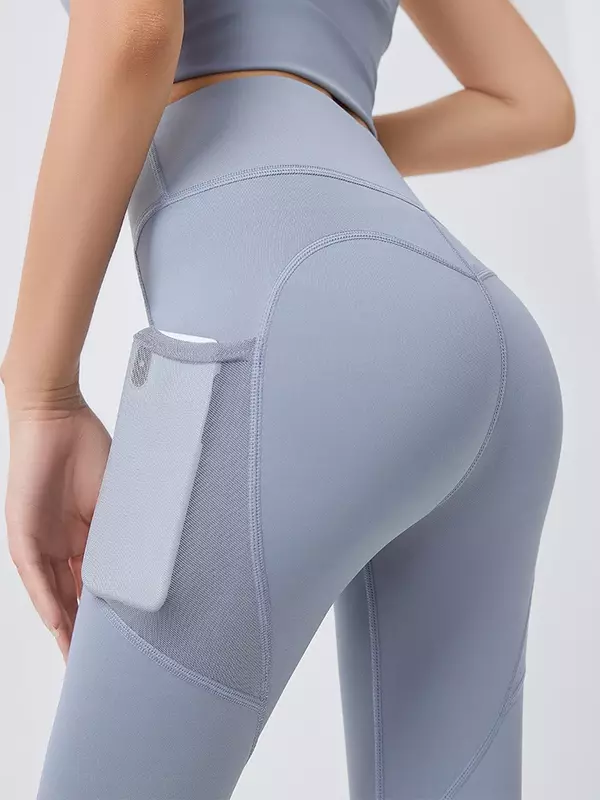 Celana Yoga kantong pinggul-mengangkat bagian bawah pakaian Yoga cepat kering bernapas peregangan Mesh kantong samping celana kebugaran lari