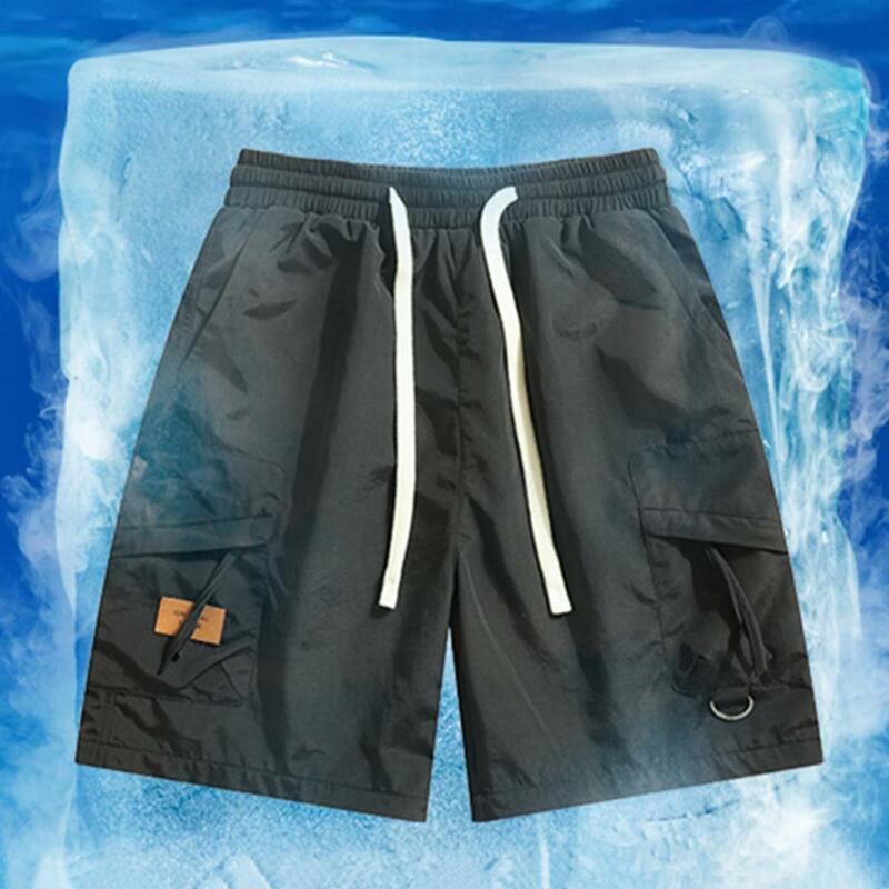 Celana pendek olahraga pria, celana pendek kargo serbaguna dengan pinggang yang dapat disesuaikan banyak saku untuk gaya jalan musim panas pria Solid