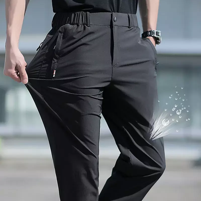 Duże rozmiary męskie spodnie na lato duży rozmiar lodowy jedwab Stretch oddychające proste nogawki 6XL szybkie suche gumki czarne spodnie