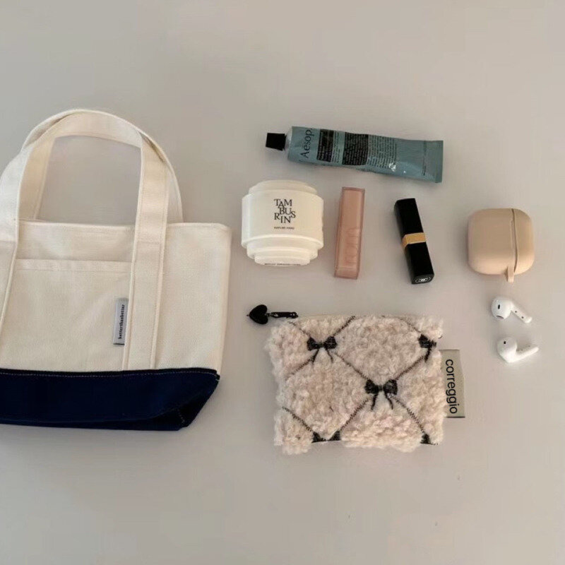 Koreański styl biały Mini Bag kokarda projekt haftu torebki na makijaż śliczna szminka karta portmonetka Mini suwak kosmetyczna torba dla kobiet
