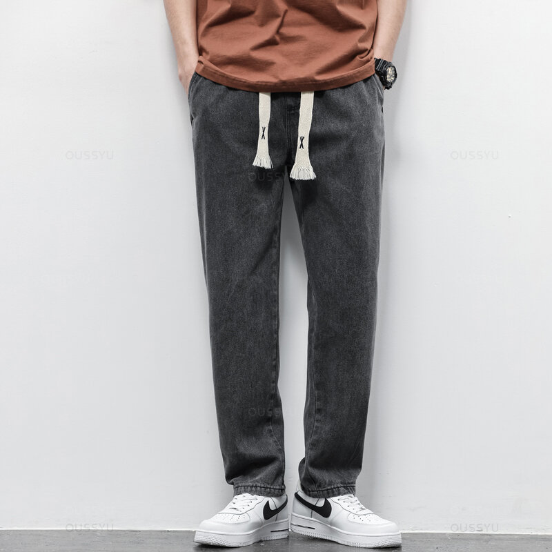 Wiosenne letnie męskie dżinsy bawełniane miękkie sznurkiem proste spodnie w pasie Vintage Korea Casual spodnie męskie Plus rozmiar S-5XL