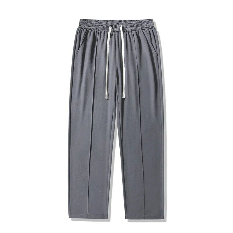 Wiosna i lato jednolity kolor modne lekkie spodnie ze stretchem luźne spodnie sportowe duży rozmiar proste spodnie M-4XL