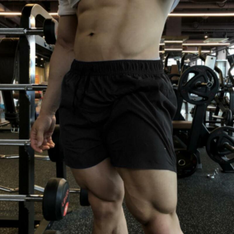 Shorts de fitness masculino casual com elástico na cintura, shorts esportivos de secagem rápida para pernas largas, verão