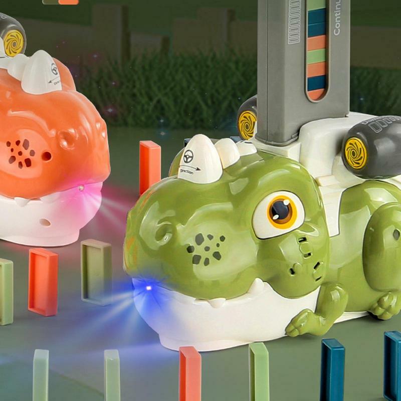 Giocattolo elettrico automatico del treno del Domino del dinosauro con il giocattolo del gioco d'impilamento del blocchetto di costruzione educativo precoce della luce e del suono per i bambini