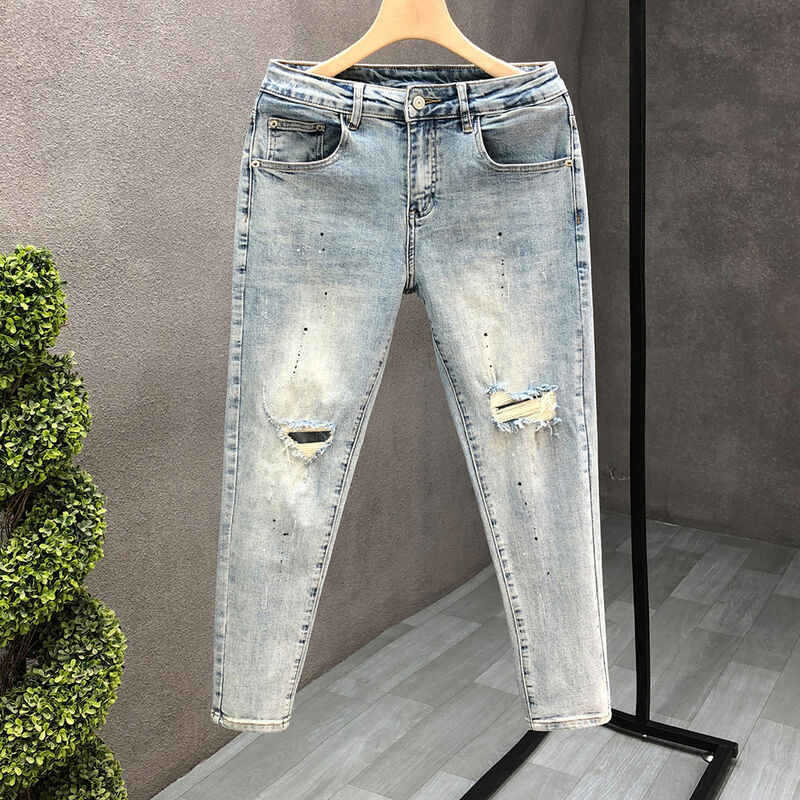 Projektantka mody męskie dopasowane jeansy rurki rozpryski atramentu wyrwane otwory na wiosnę i jesień odzież na co dzień w trudnej sytuacji stylowe spodnie ołówkowe