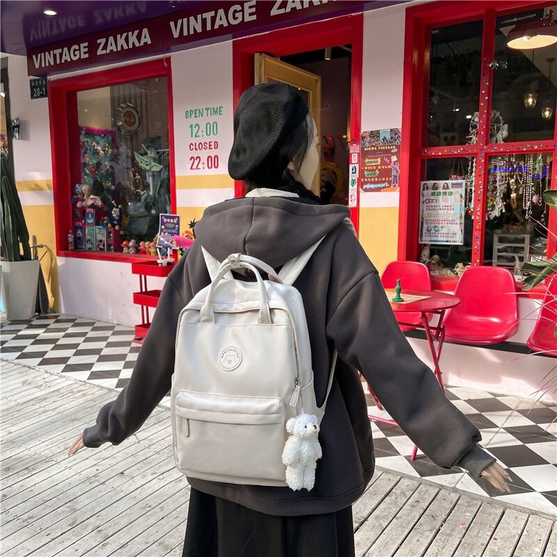 Tas punggung banyak saku pria wanita, baru warna Solid tas tangan nilon tas sekolah santai kapasitas besar tas ransel komputer sederhana