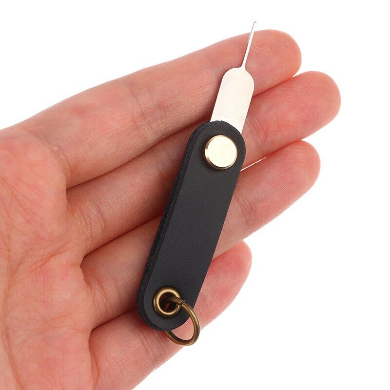 Herramienta de llave de aguja de Pin abierto para teléfono móvil Universal para iPhone 12/SamSung, bandeja de tarjeta Sim de expulsión, cuero PU, giratorio de 360 °, portátil, 1 unidad