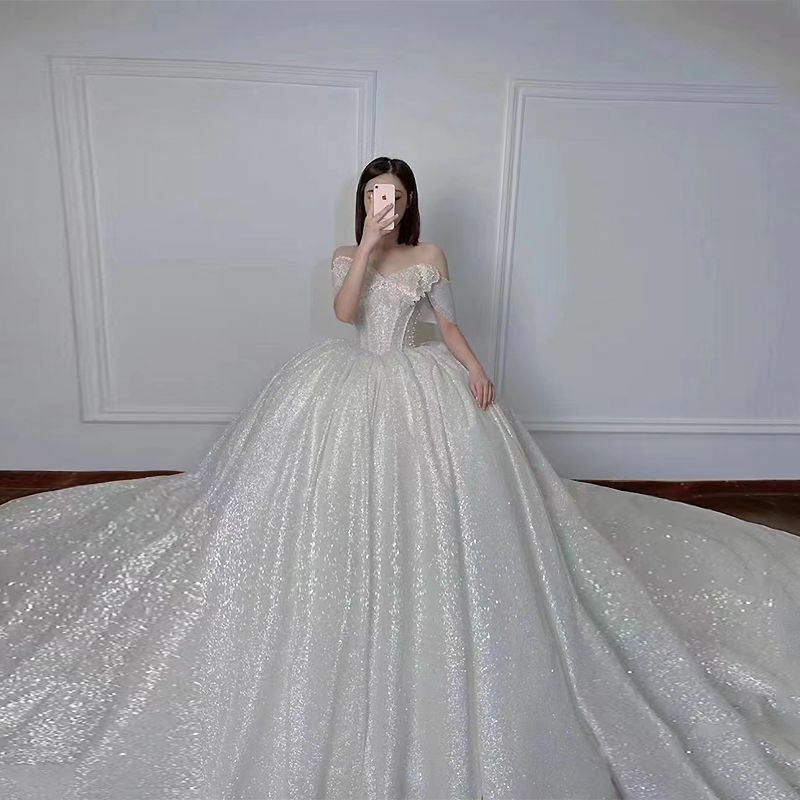 เจ้าหญิงโบว์ Pearrls Ball Gown ชุดแต่งงานที่หรูหรา Glitter เลื่อมแขนกุดชุดเจ้าสาว Court รถไฟโบสถ์ Robe De Mariée