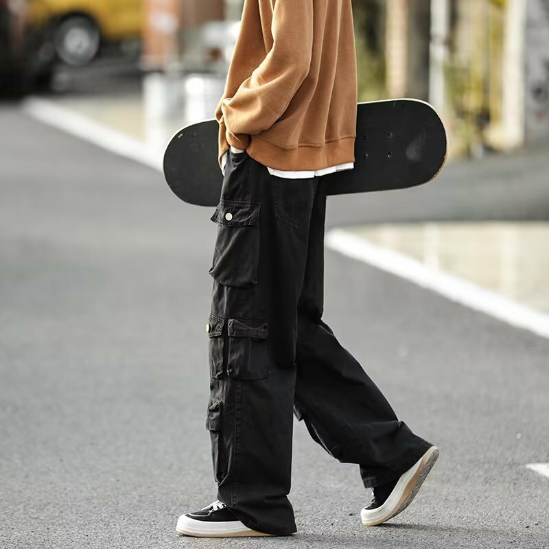 Jalanan populer banyak saku overall pria gaya Harajuku celana kasual longgar jalan tinggi Retro wanita celana panjang Hip Hop longgar