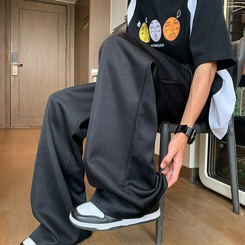 Celana kasual pria versi Korea dari tren liontin celana olahraga tampan 2024 celana baru musim panas