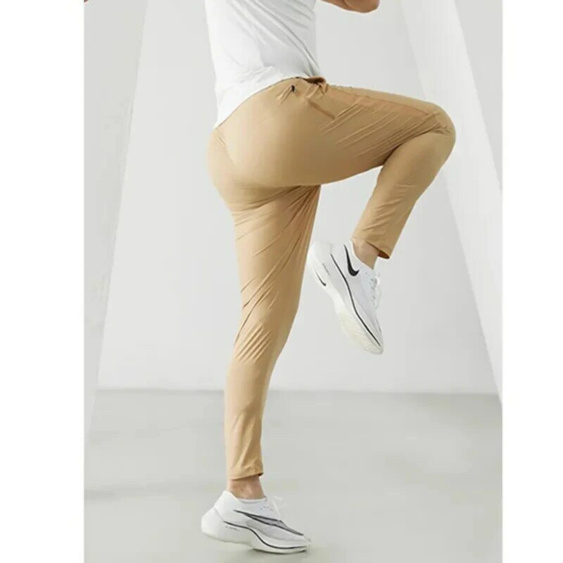กางเกงวิ่งกางเกงกีฬาสำหรับผู้ชายกางเกงวิ่งออกกำลังกายแบบยืดหยุ่นกางเกงออกกำลังกายแบบบางแห้งเร็ว celana Panjang ketat ออกกำลังกาย