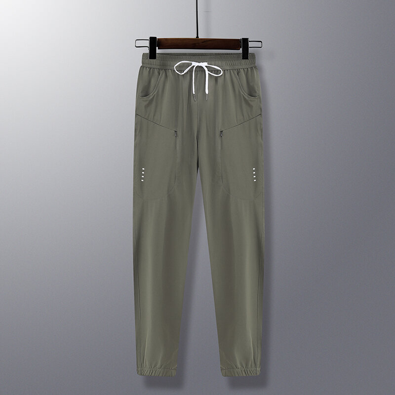 Wiosenna letnia męska jednolita elastyczna wysoka talia z kieszeniami na suwak wiązana codzienna latarnia Harlan spodnie Cargo odzież spodnie damskie biurowa