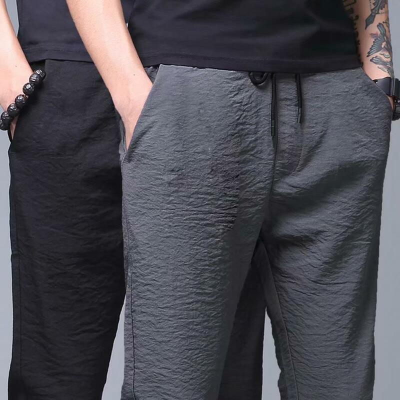 Mid-rise Elastic Waistband Men Pants Drawstring Pockets Pleated Summer Ice Silk Thin Straight Leg Pants Streetwear